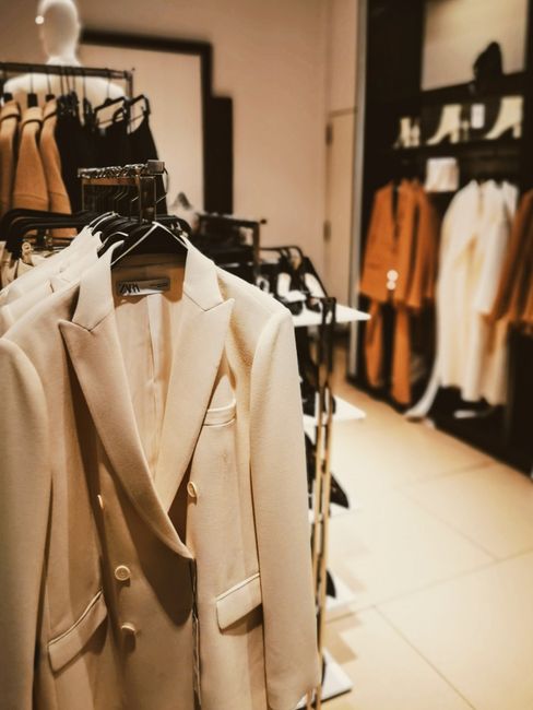 Clothes on rails inside the shop
