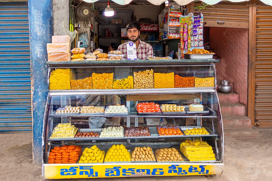 A variety of Indian sweets displayed at a shop in Kaikaluru, Andhra Pradesh, India.